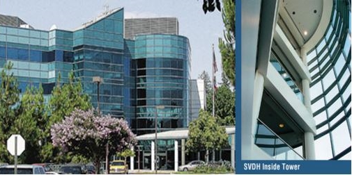 the new sierra view hospital, a tall building covered in glass windows 